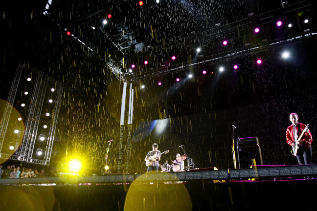 The heavens crack open above Vampire Weekend.
