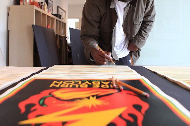 Darryl Jenifer signing Shepard Fairey's prints